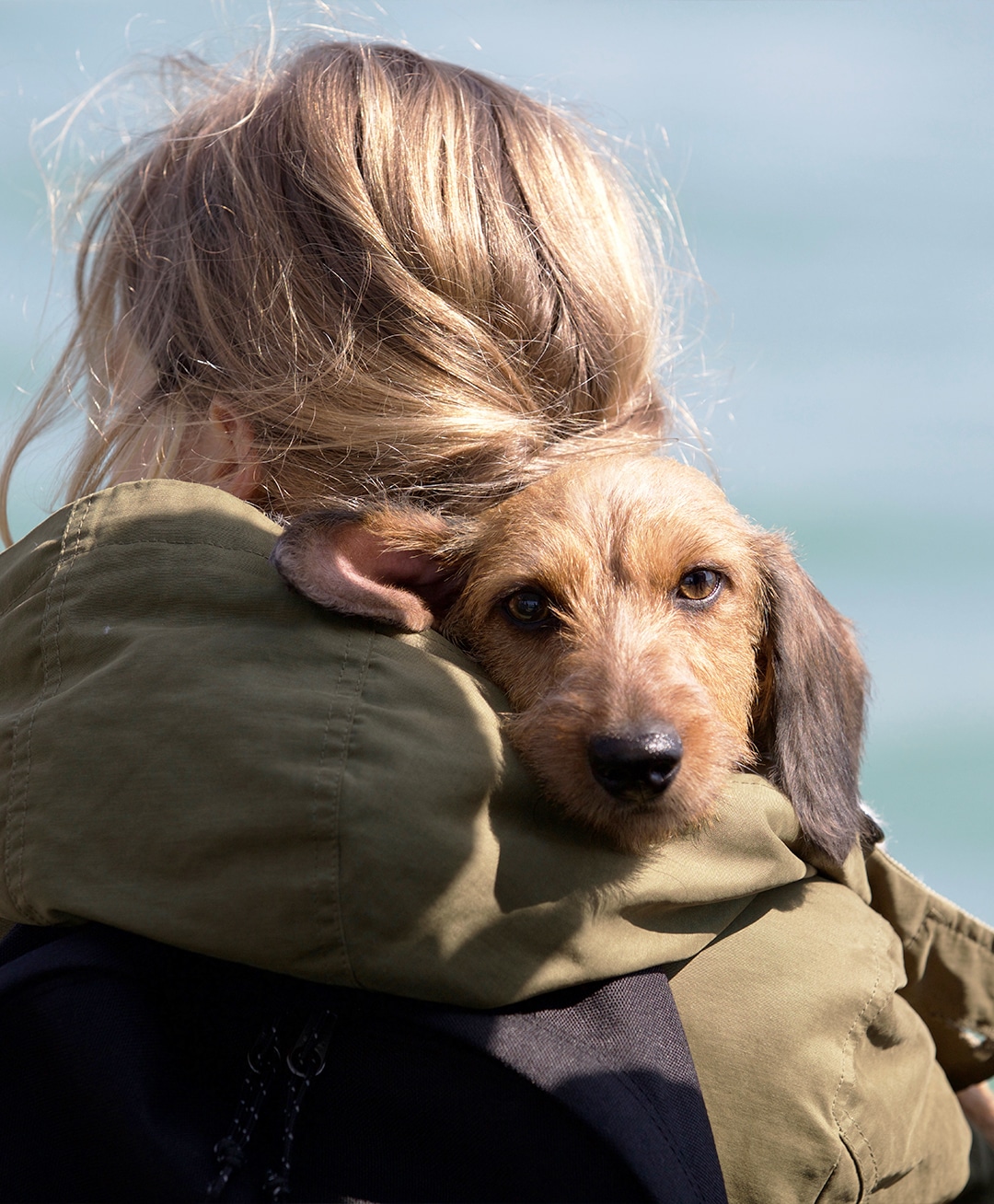 woman holding her dog close in Lynnwood, WA